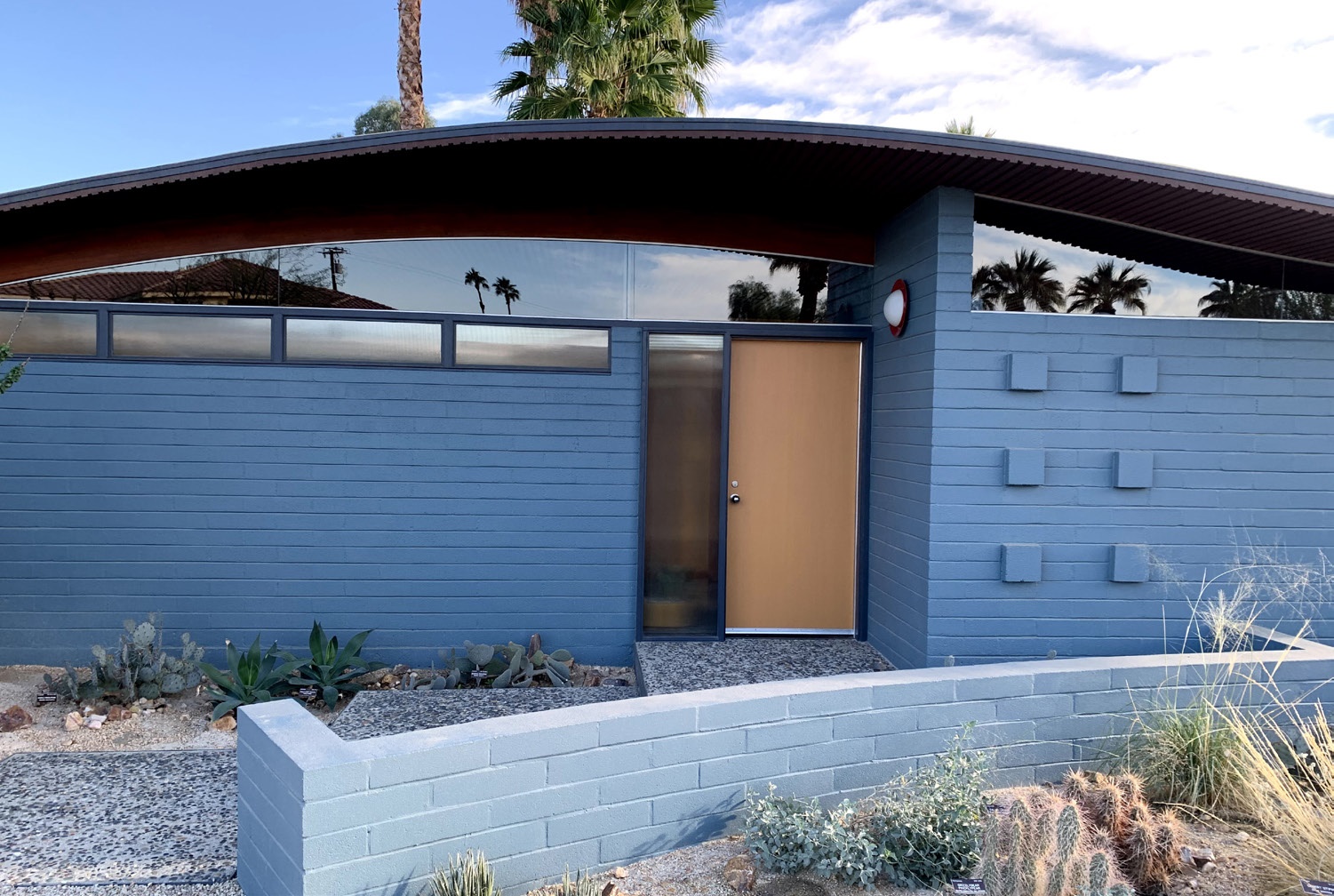 Exterior front view of house, addition to building has been removed, house has been repainted to original color